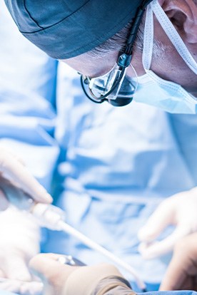 an oral surgeon placing dental implants 