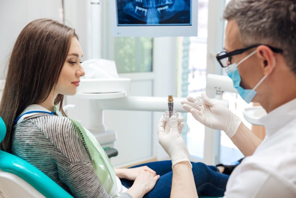 A woman at the dentist discussing dental implants